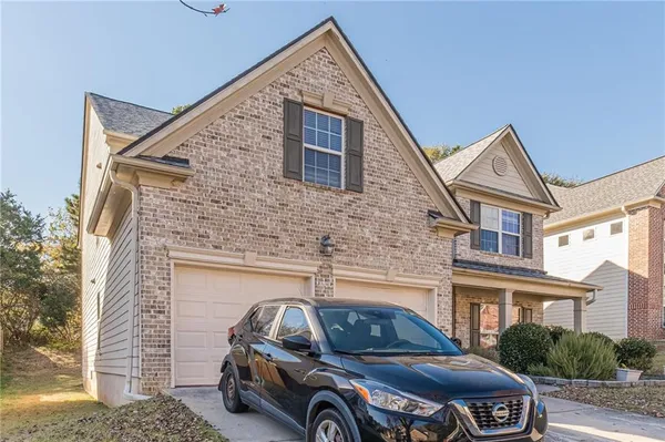 a car parked in front of a house