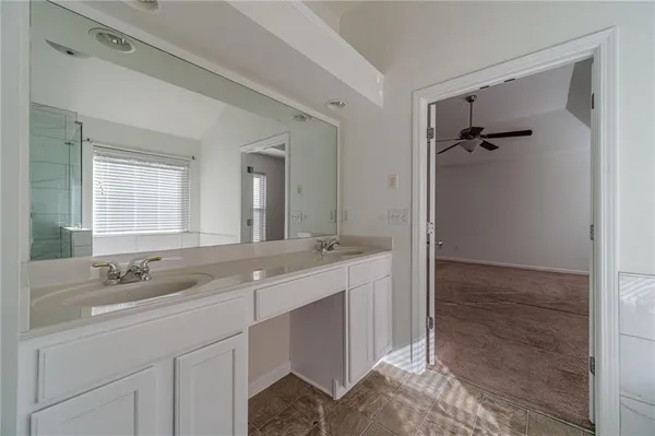 a bathroom with a sink and mirror