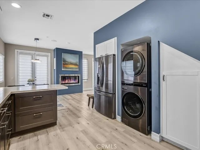 a kitchen with stainless steel appliances granite countertop a sink stove and microwave