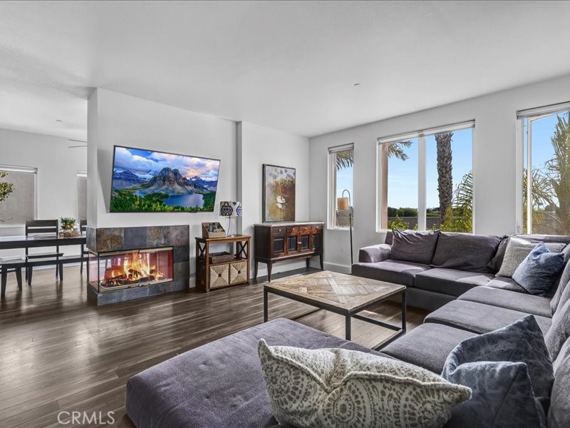 3405 South El Camino Real, Unit A San Clemente, CA 92672 - Photo 28 of 58 a living room with furniture and a flat screen tv