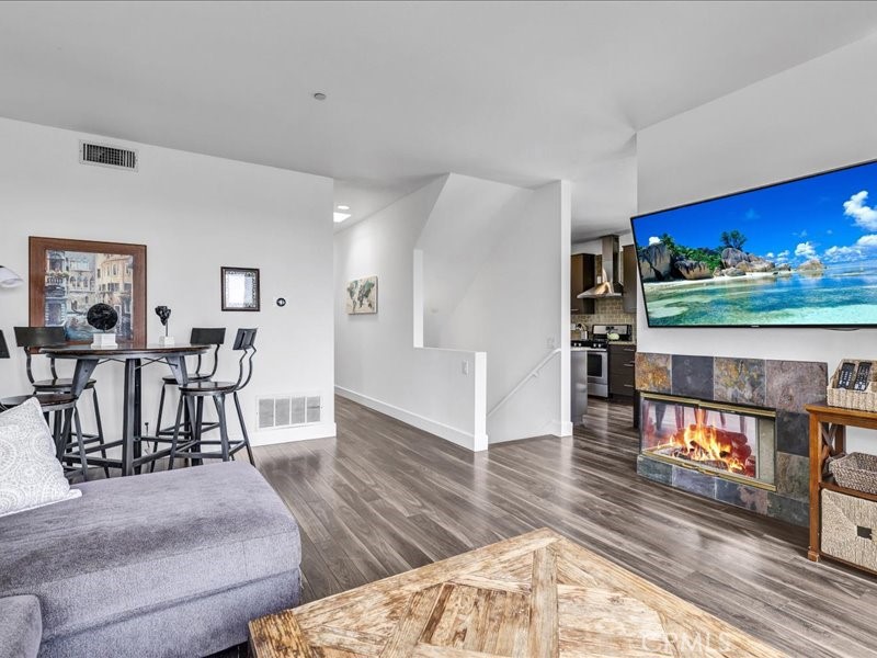 3405 South El Camino Real, Unit A San Clemente, CA 92672 - Photo 29 of 58 a living room with furniture and a wooden floor