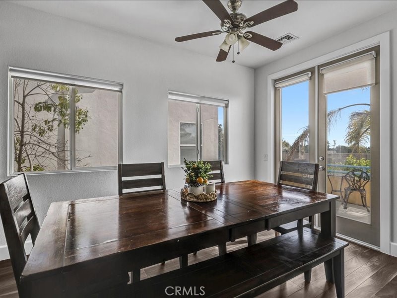 3405 South El Camino Real, Unit A San Clemente, CA 92672 - Photo 30 of 58 a view of a dining room with furniture window and wooden floor