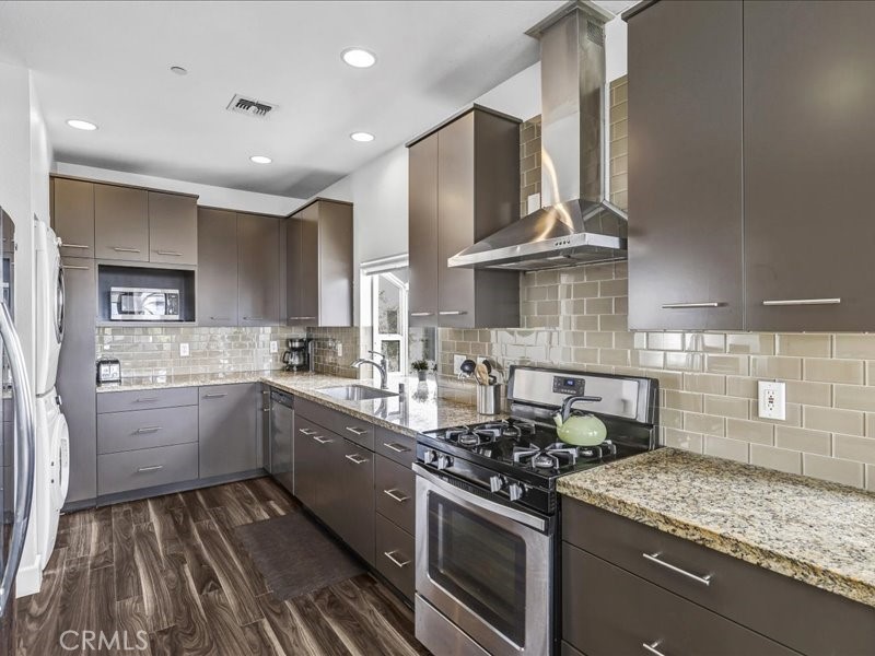 3405 South El Camino Real, Unit A San Clemente, CA 92672 - Photo 32 of 58 a kitchen with a stove and a sink