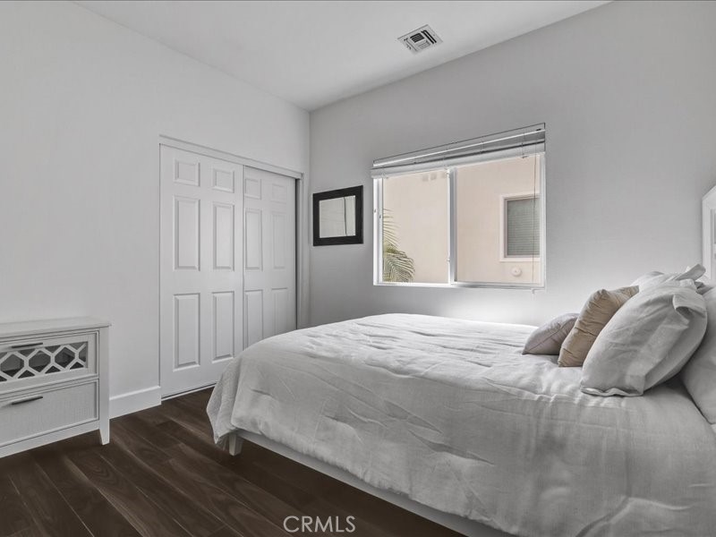 3405 South El Camino Real, Unit A San Clemente, CA 92672 - Photo 35 of 58 a bedroom with a bed and a window