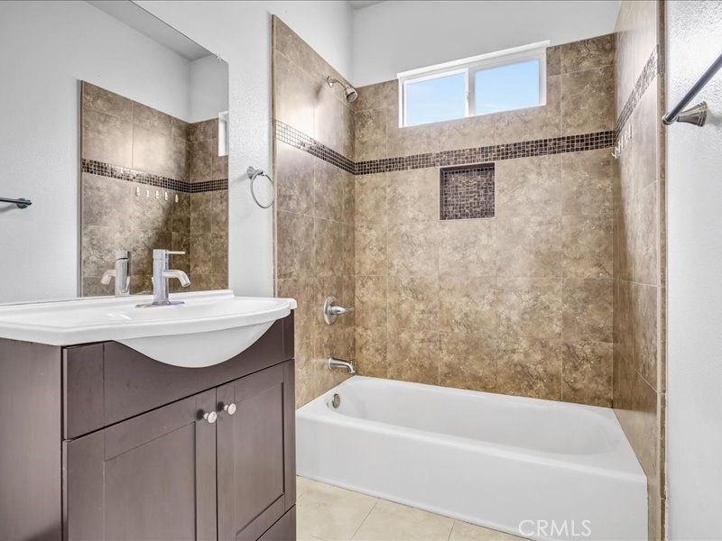 3405 South El Camino Real, Unit A San Clemente, CA 92672 - Photo 36 of 58 a bathroom with a sink mirror toilet and bathtub