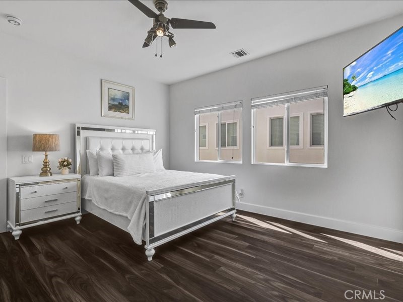 3405 South El Camino Real, Unit A San Clemente, CA 92672 - Photo 37 of 58 a white bed sitting in a bedroom next to a window