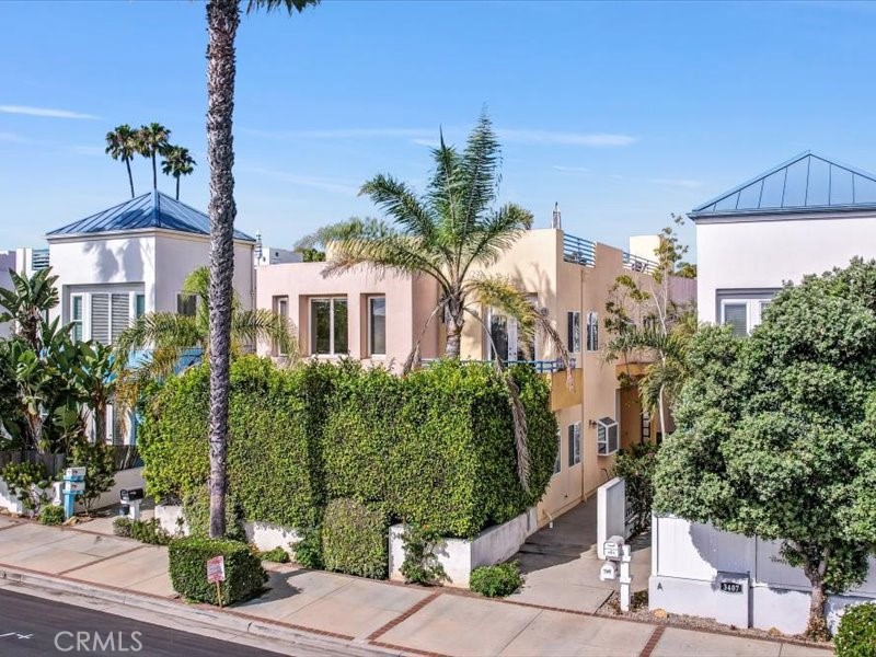 3405 South El Camino Real, Unit A San Clemente, CA 92672 - Photo 4 of 58 a front view of a house with a yard and tree s