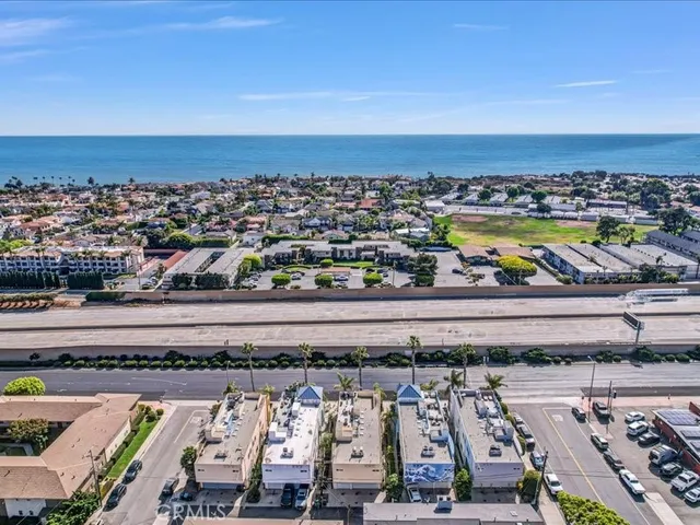 an aerial view of residential houses and city view