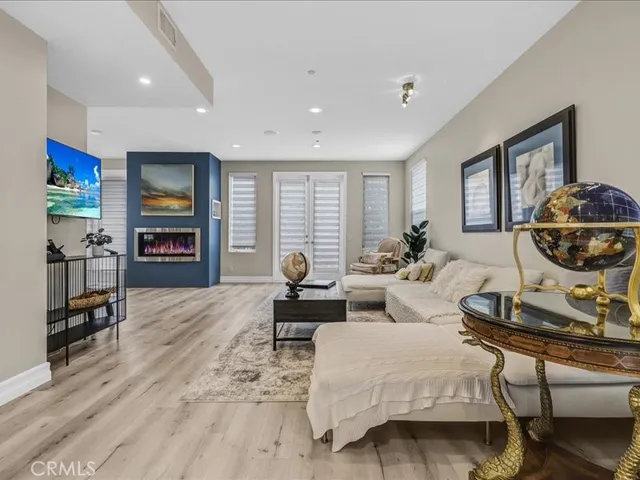 a living room with furniture or couch and a potted plant
