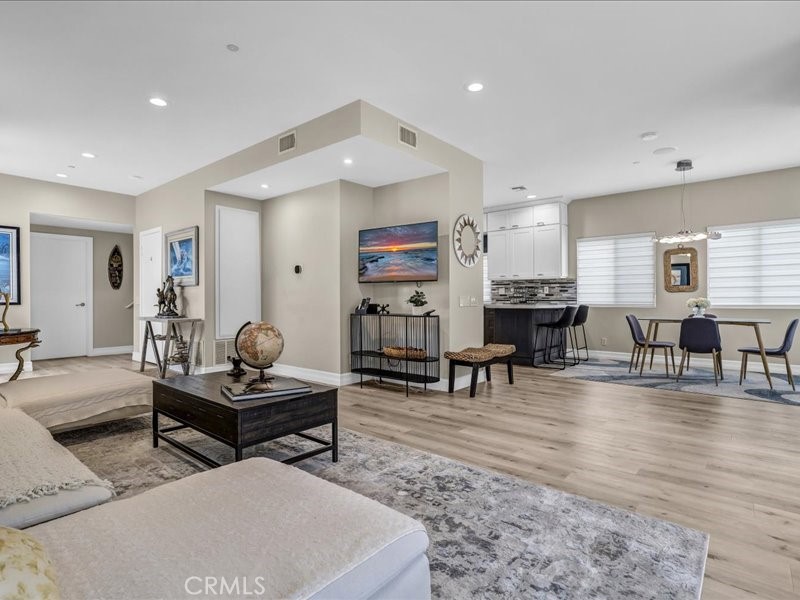 3405 South El Camino Real, Unit A San Clemente, CA 92672 - Photo 8 of 58 a living room with fireplace furniture and a dining table