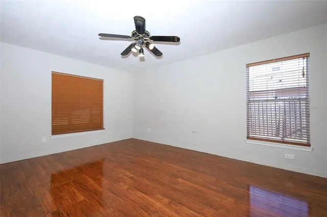 a view of a big room with windows