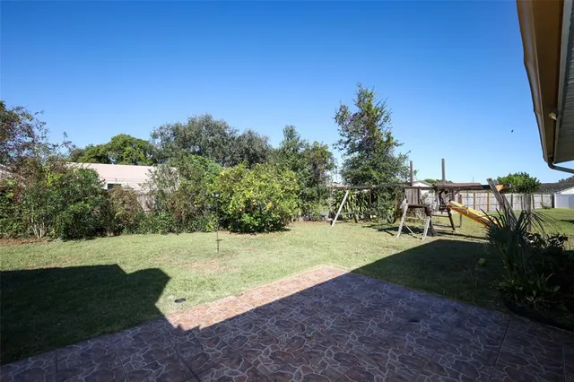 a view of backyard with green space