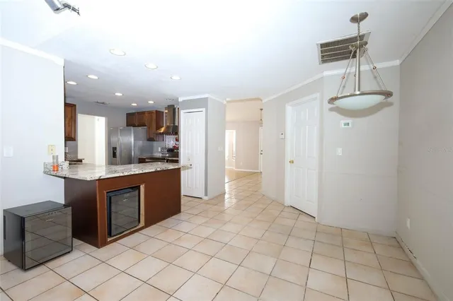a kitchen with stainless steel appliances a sink and cabinets
