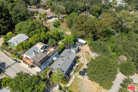 an aerial view of a house with mountain view