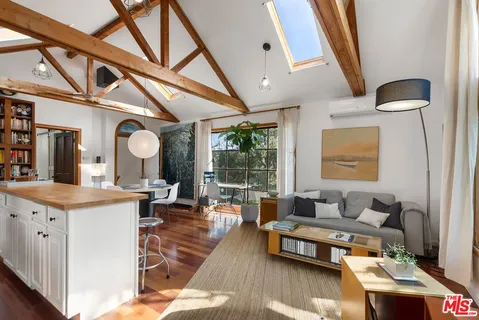 a living room with granite countertop furniture and a large window