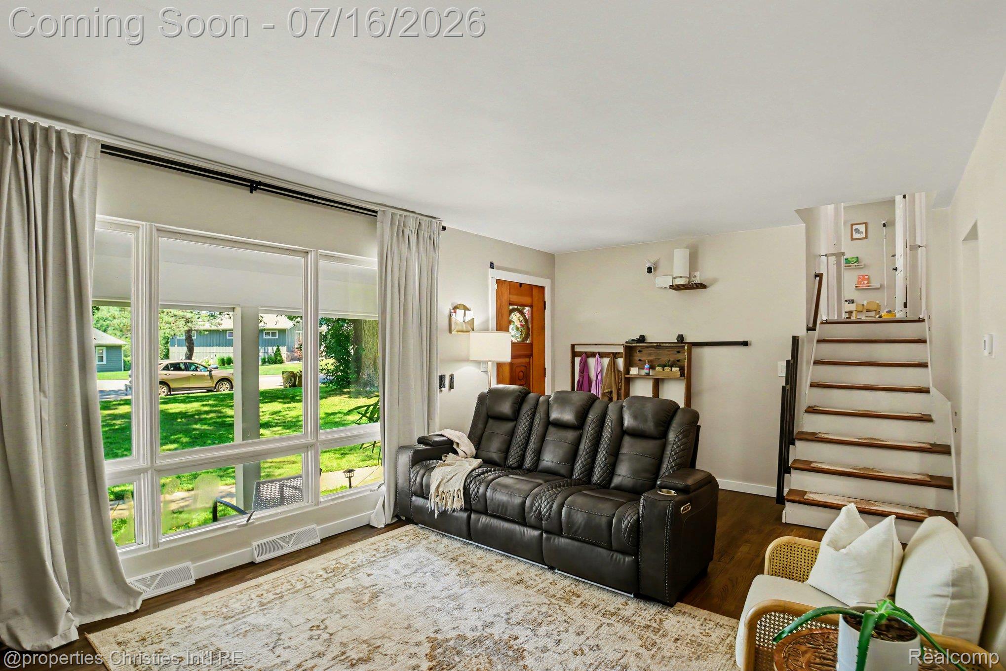 3304 Riverside Drive Port Huron, MI 48060 - Photo 3 of 26 Living room featuring wood-finish flooring and a large picture window