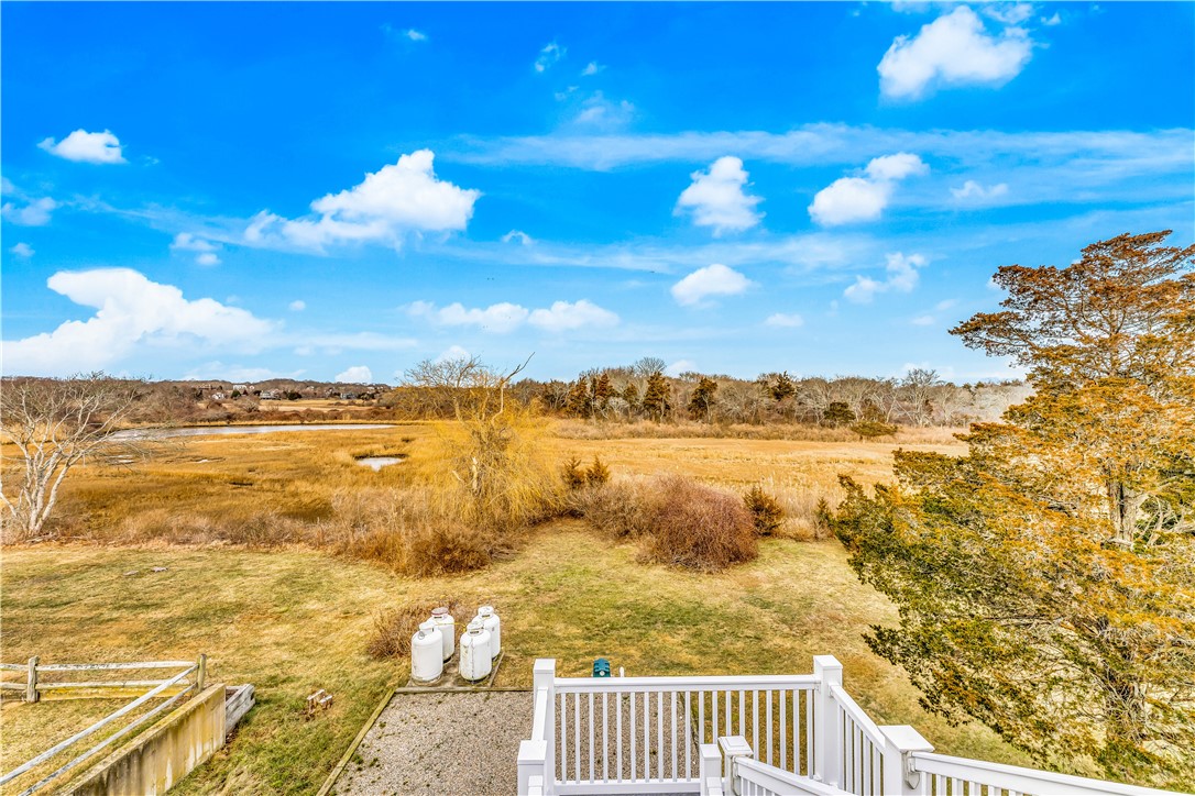 39 Weekapaug Road, Unit 3 Westerly, RI 02891 - Photo 15 of 50 Deck #3 Overlookiing Backyard and Conservation Land