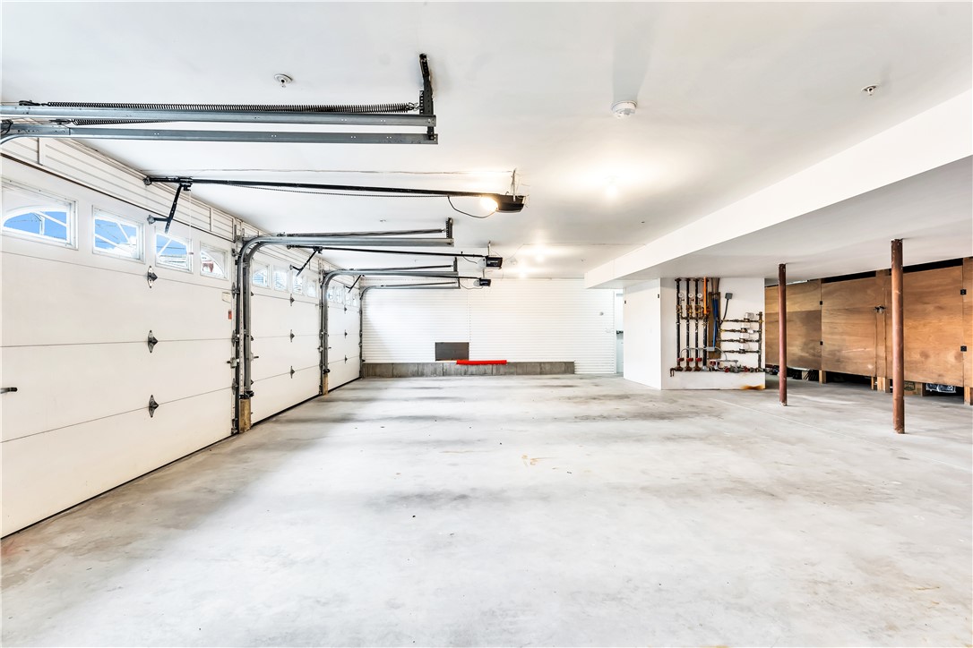 39 Weekapaug Road, Unit 3 Westerly, RI 02891 - Photo 46 of 50 Heated Oversize Garage with Storage Area