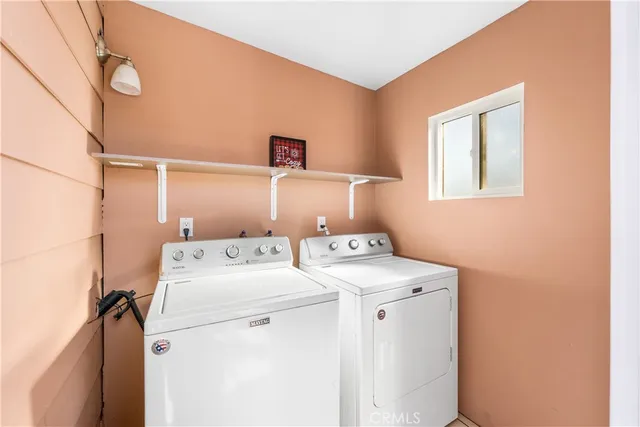 a view of a house with a door and wooden walls