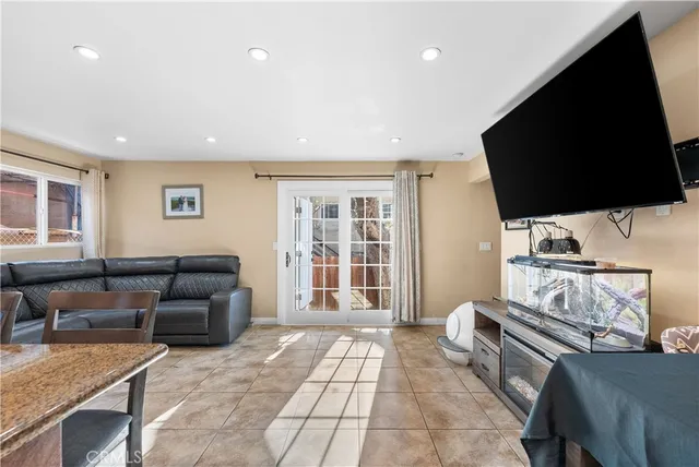 a kitchen with stainless steel appliances kitchen island granite countertop a stove and cabinets