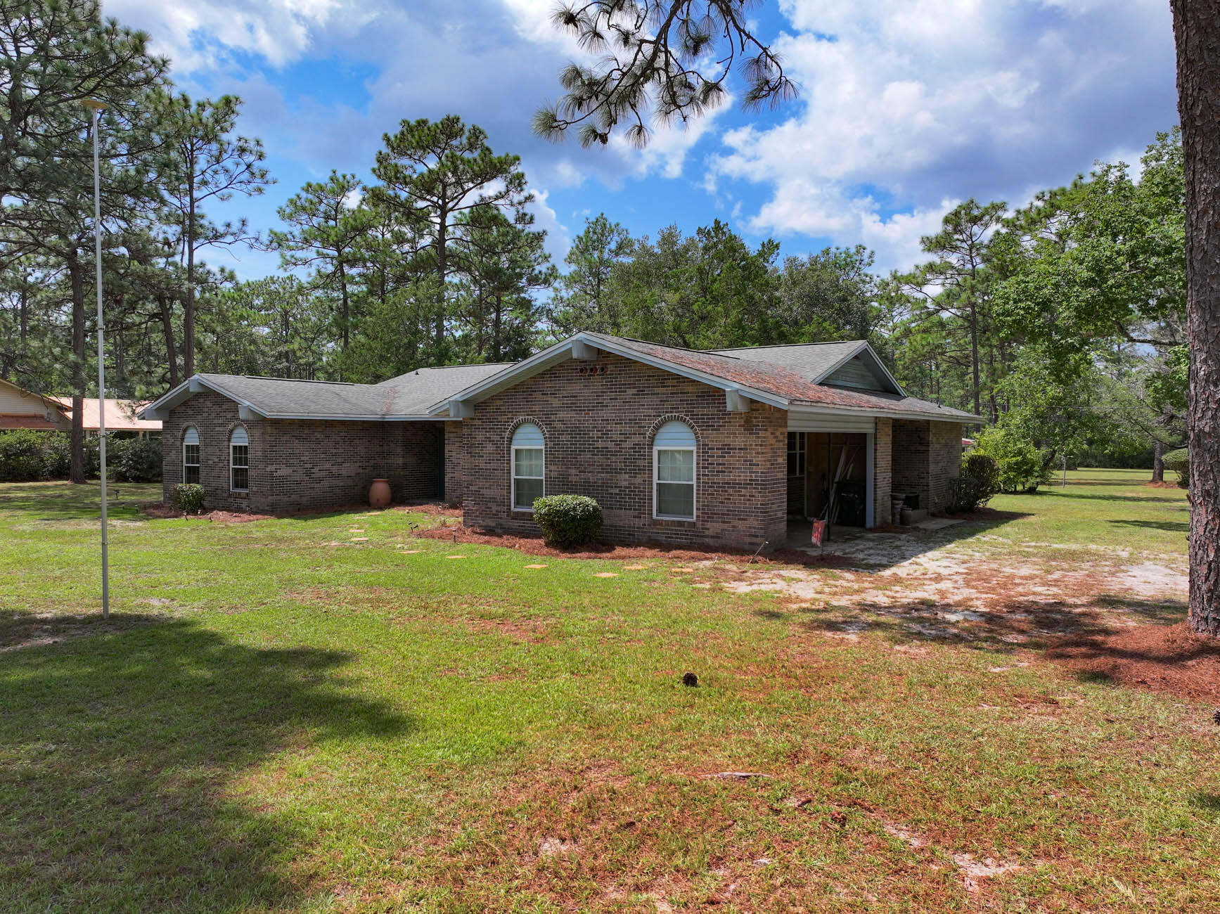 14034 331 Business Freeport, FL 32439 - Photo 11 of 44 a front view of house with yard and green space