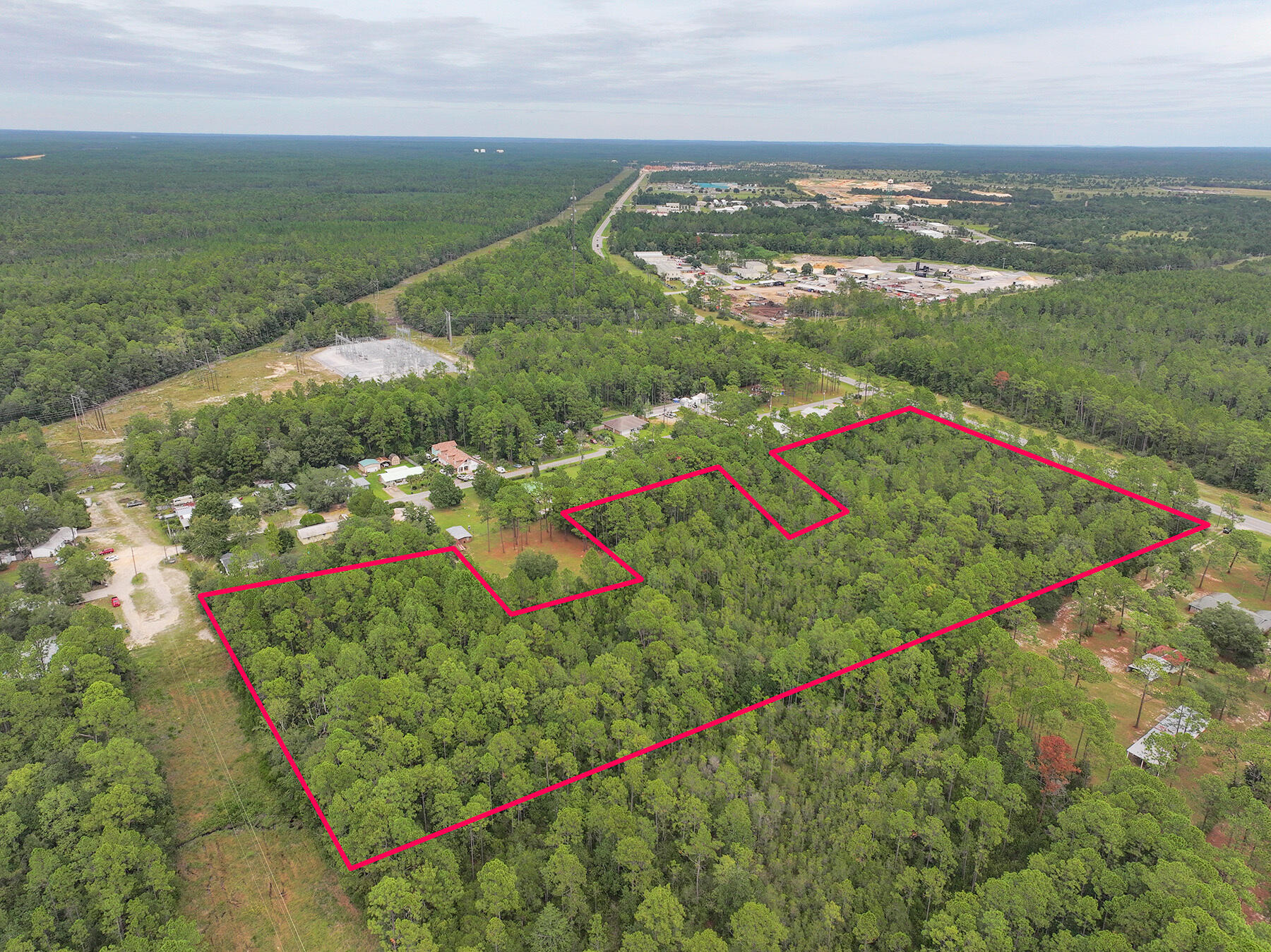 14034 331 Business Freeport, FL 32439 - Photo 3 of 44 an aerial view of residential houses with outdoor space and trees
