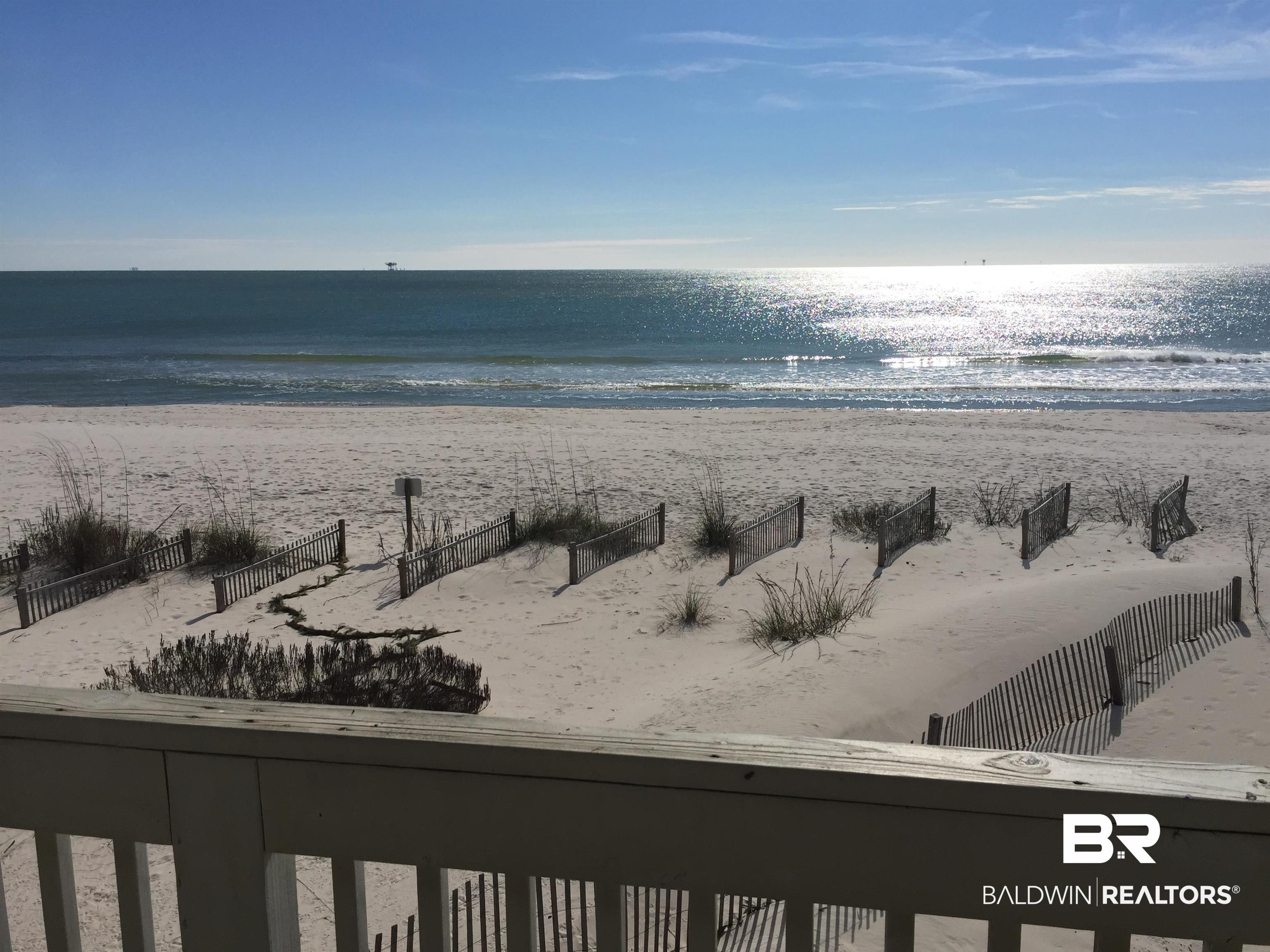 1380 Fort Morgan Road, Unit 106 Gulf Shores, AL 36542 - Photo 17 of 20 The beach behind the condo is a short walk from the building. This photo is taken near the beach access