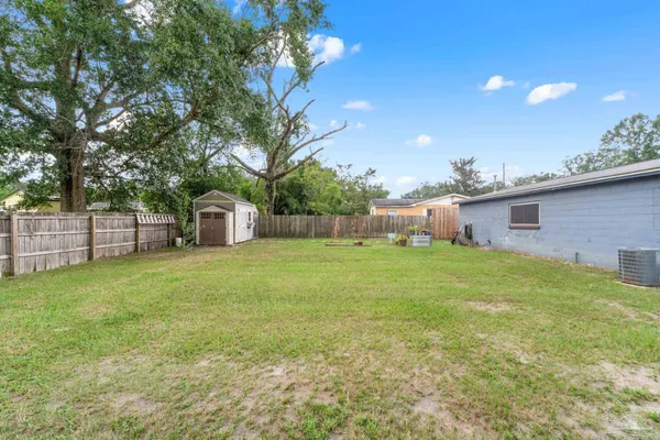 a backyard of a house with lots of green space