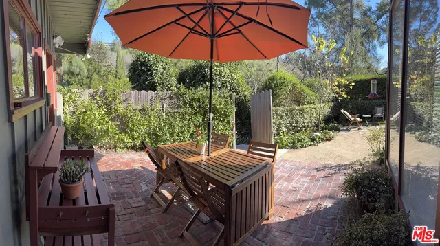 a view of yard with patio