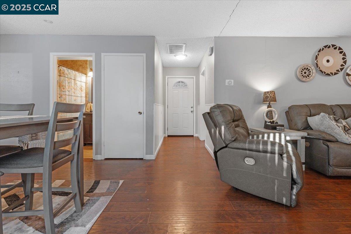 2644 East Olivera Road Concord, CA 94519 - Photo 11 of 42 a living room with furniture and wooden floor