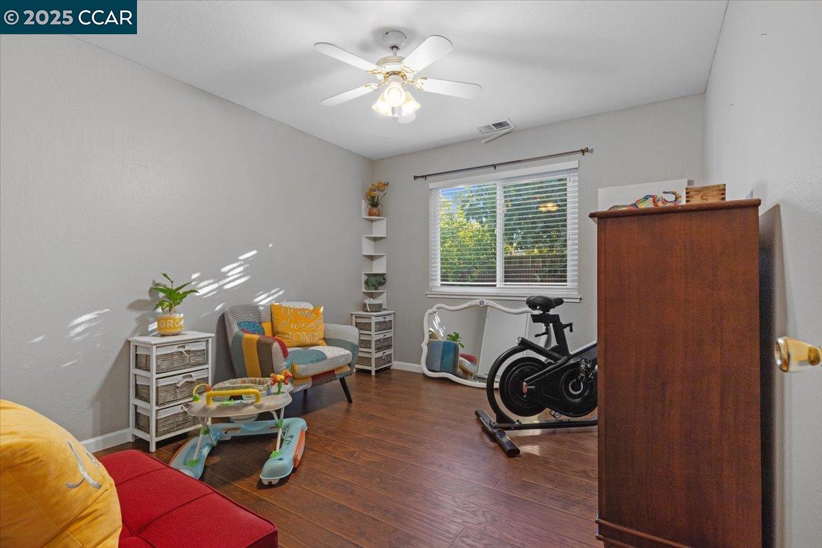 2644 East Olivera Road Concord, CA 94519 - Photo 19 of 42 a view of a workspace with furniture and a ceiling fan