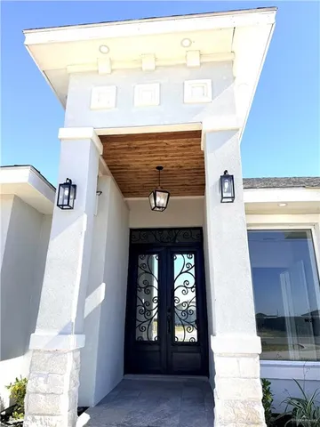 a front view of a house with a white door