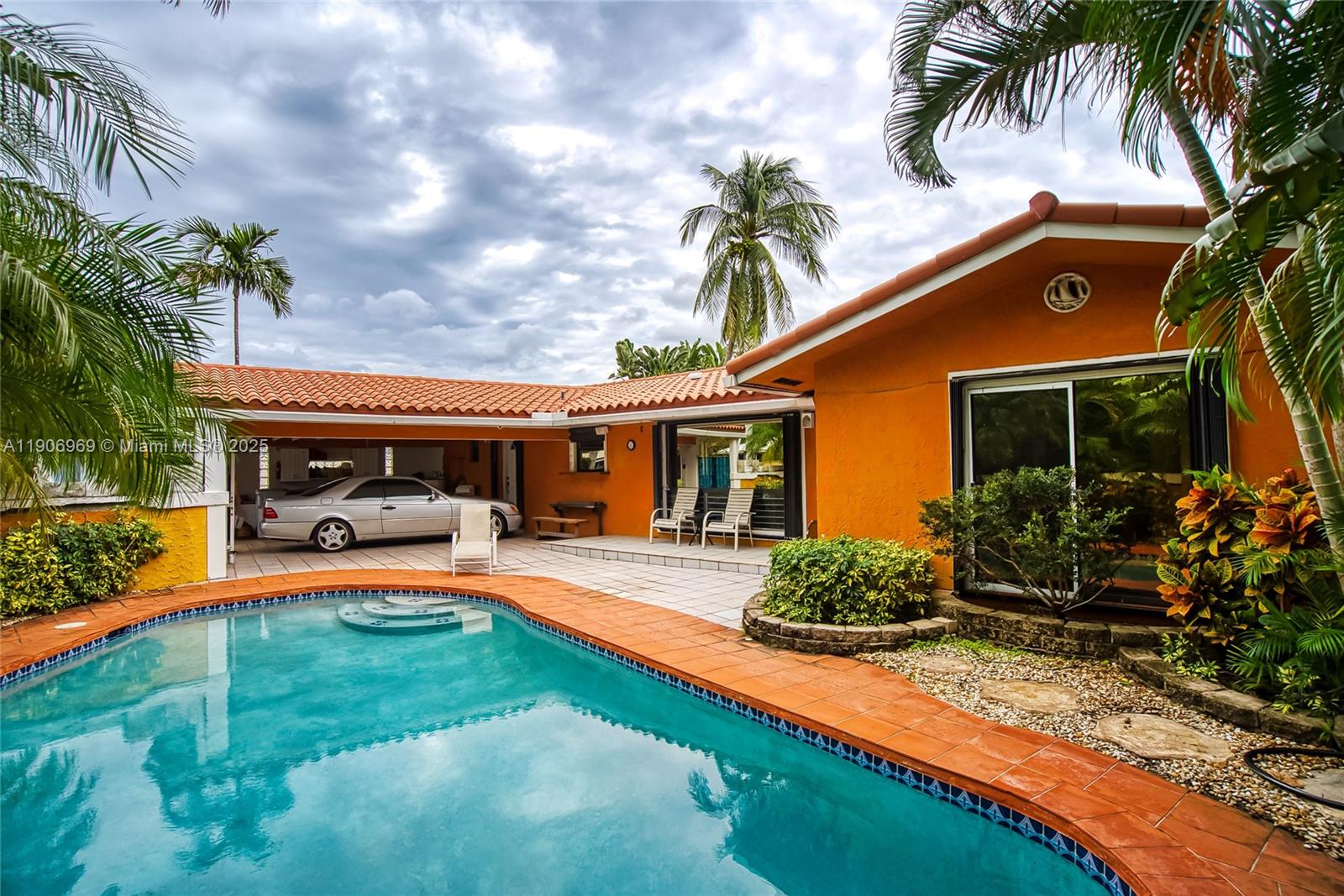 a front view of house with yard and outdoor seating