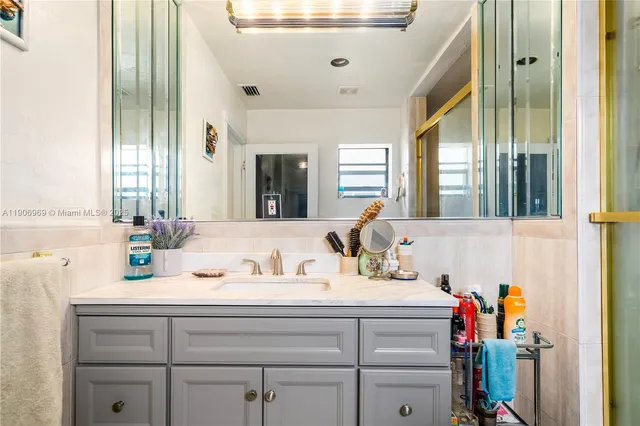 a bathroom with a sink and a mirror