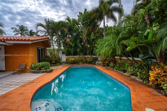 a view of swimming pool from a balcony