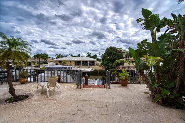 a view of balcony with wooden floor and outdoor seating