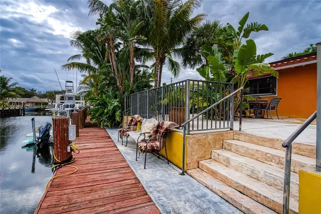 a front view of house with yard and trees