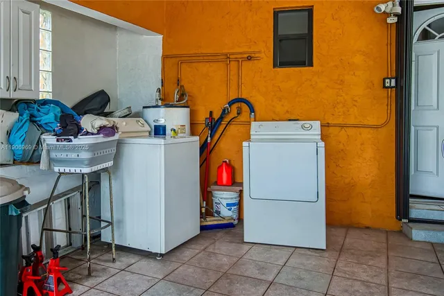 an aerial view of residential house with yard and swimming pool