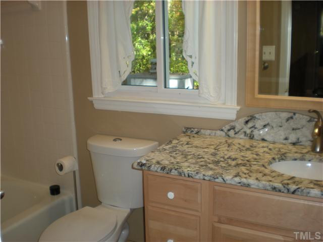 3417 Hackney Court Raleigh, NC 27613 - Photo 20 of 23 Another full bath upstairs with marble vanity and ceramic tile surround in the tub/shower. Bath also adjoins one of the secondary bedrooms. This home offers such versatility and comfort for family or visiting guests. Bathroom