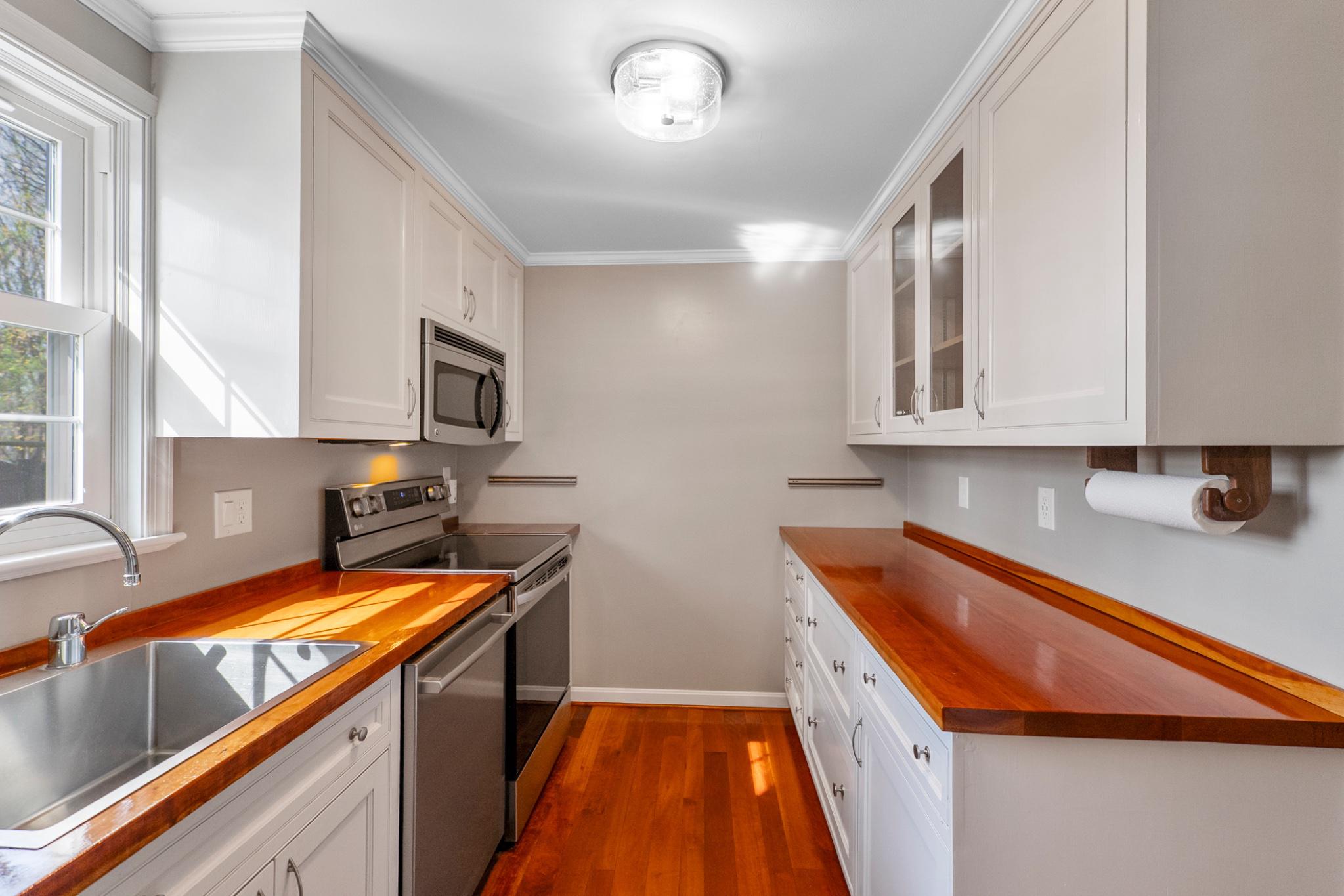 9918 Canvasback Way Damascus, MD 20872 - Photo 12 of 32 a kitchen with stainless steel appliances granite countertop a sink a stove top oven a counter space and cabinets