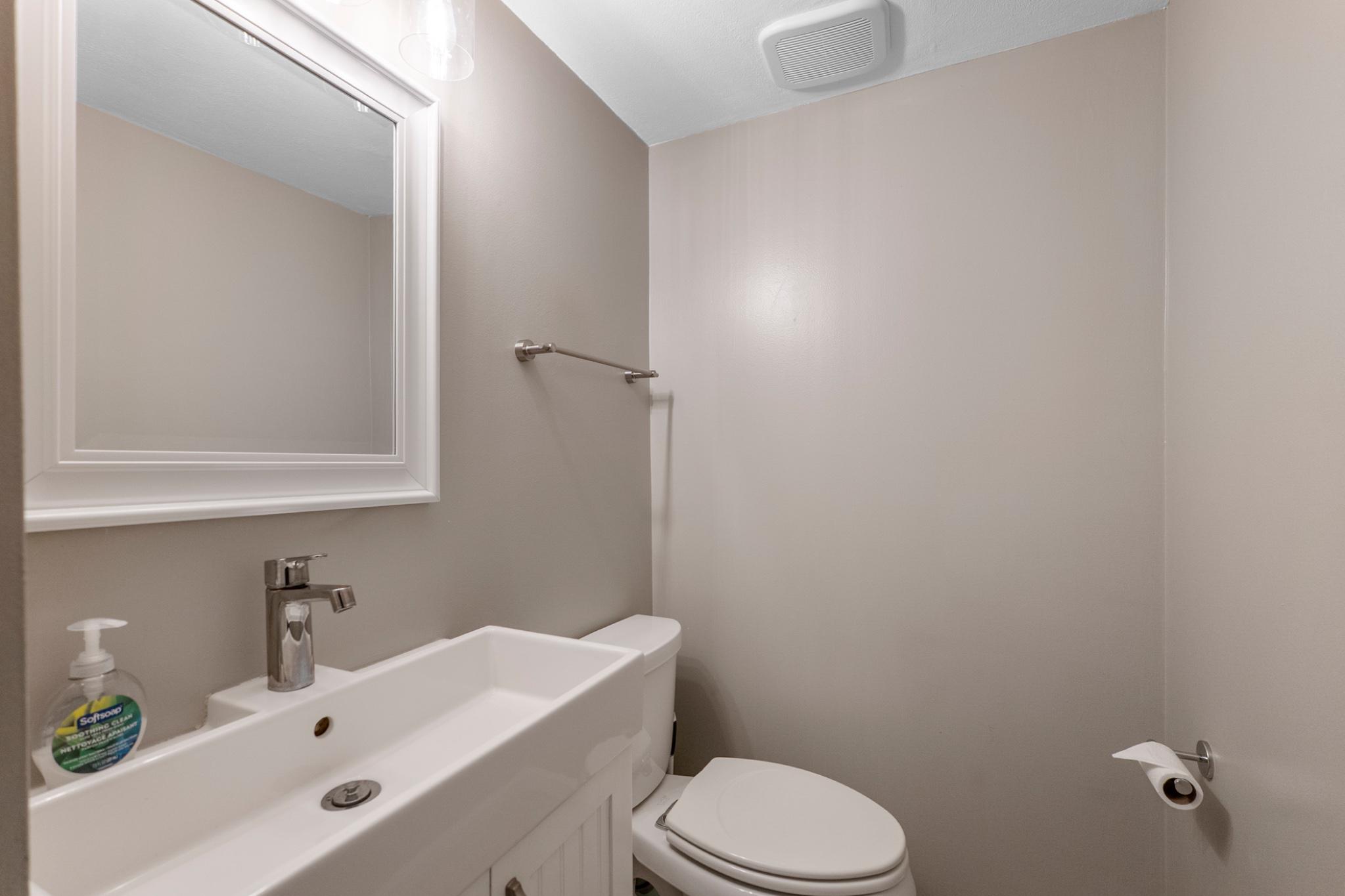 9918 Canvasback Way Damascus, MD 20872 - Photo 14 of 32 a bathroom with a white bath tub a sink and mirror