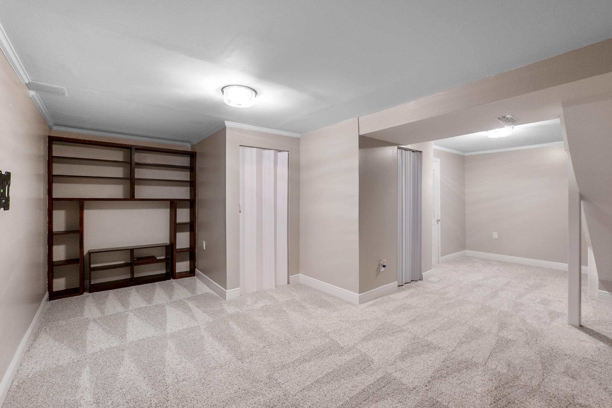 9918 Canvasback Way Damascus, MD 20872 - Photo 28 of 32 a view of an empty room with a fireplace