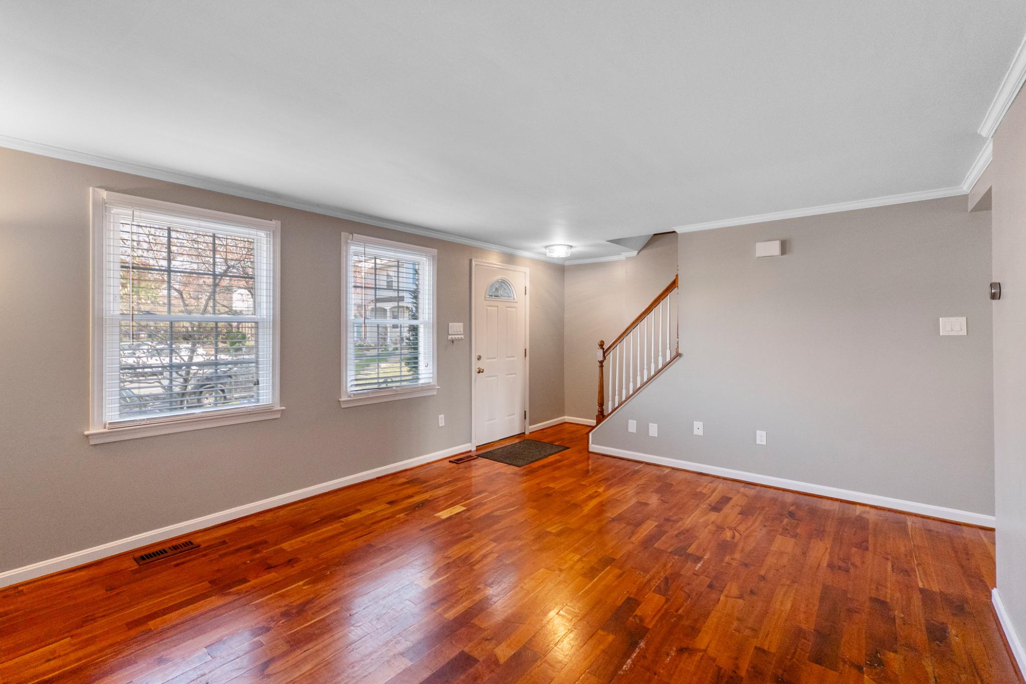 9918 Canvasback Way Damascus, MD 20872 - Photo 3 of 32 a view of an empty room with wooden floor and a window