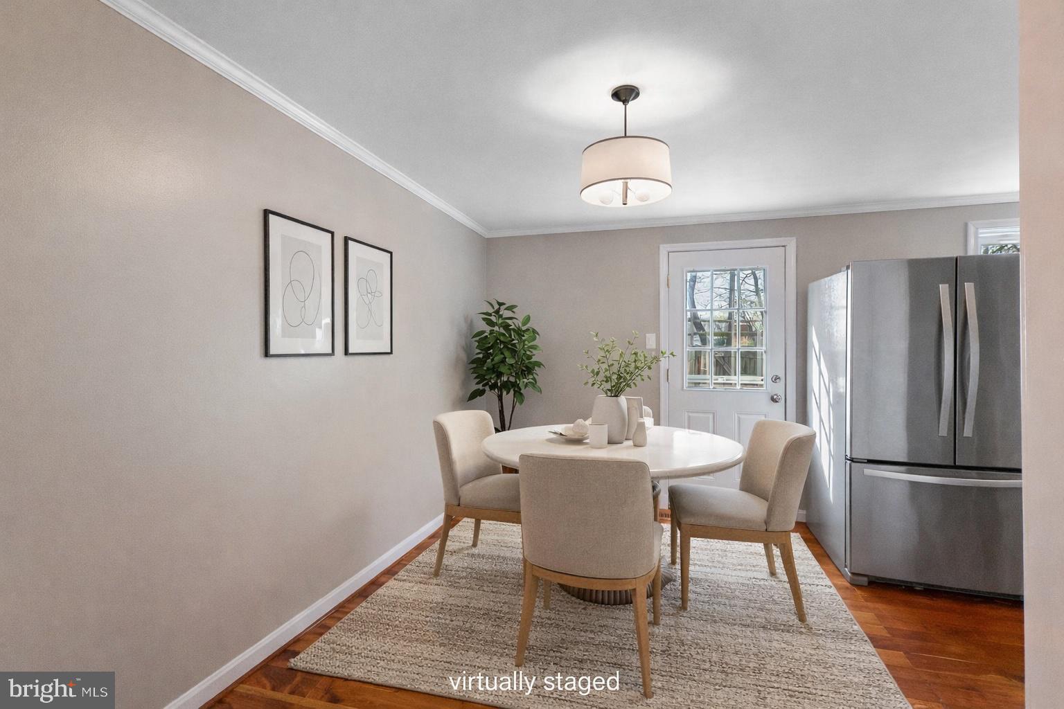 9918 Canvasback Way Damascus, MD 20872 - Photo 7 of 32 a view of a dining room with furniture window and wooden floor