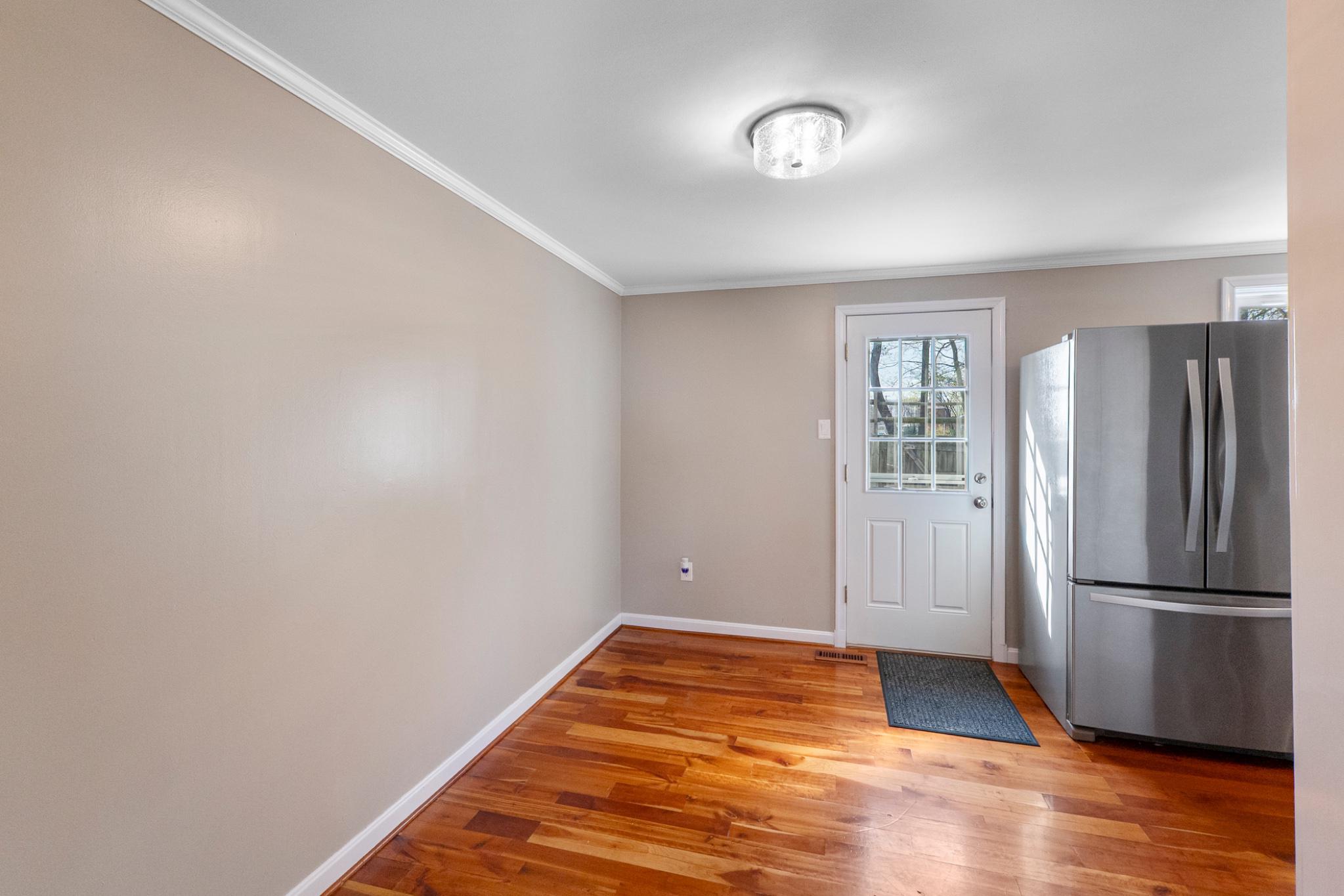 9918 Canvasback Way Damascus, MD 20872 - Photo 8 of 32 a view of a livingroom with wooden floor