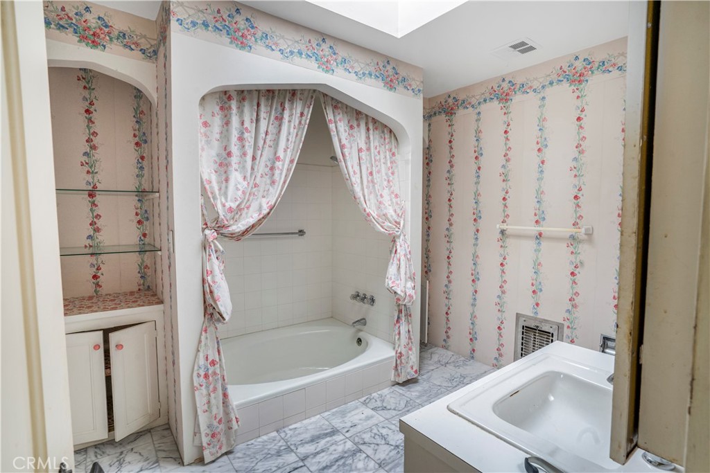 2736 Cuesta Road Santa Barbara, CA 93105 - Photo 17 of 50 a bathroom with a sink a bathtub and a shower