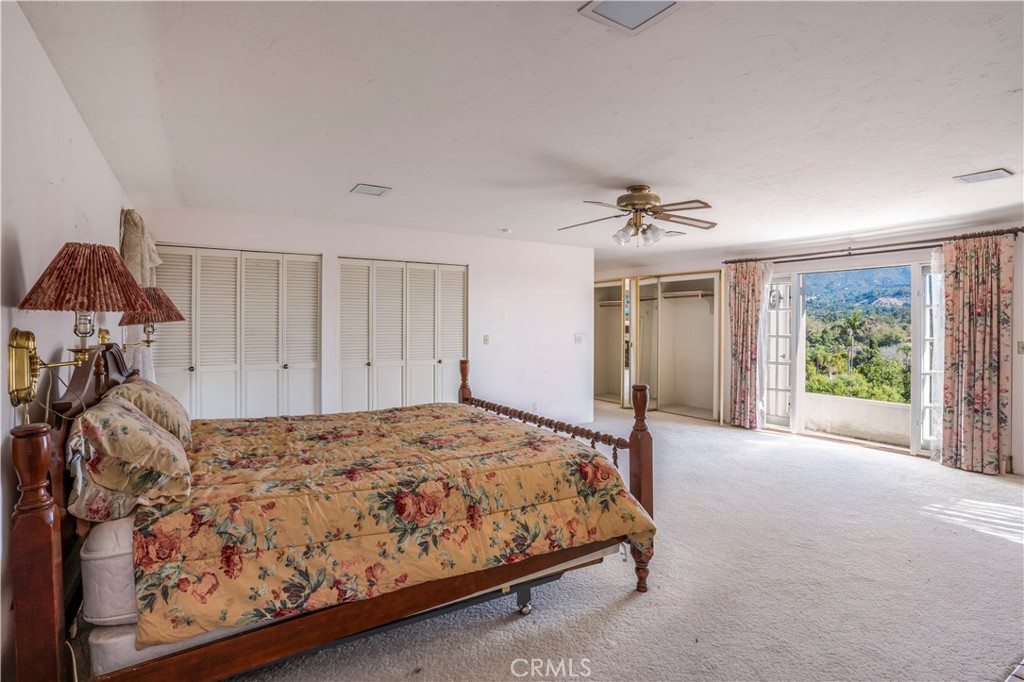 2736 Cuesta Road Santa Barbara, CA 93105 - Photo 21 of 50 a bedroom with a bed and a window