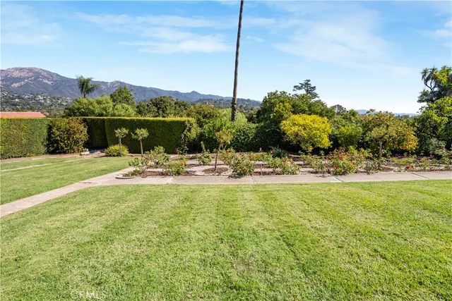 a view of a golf course with an ocean