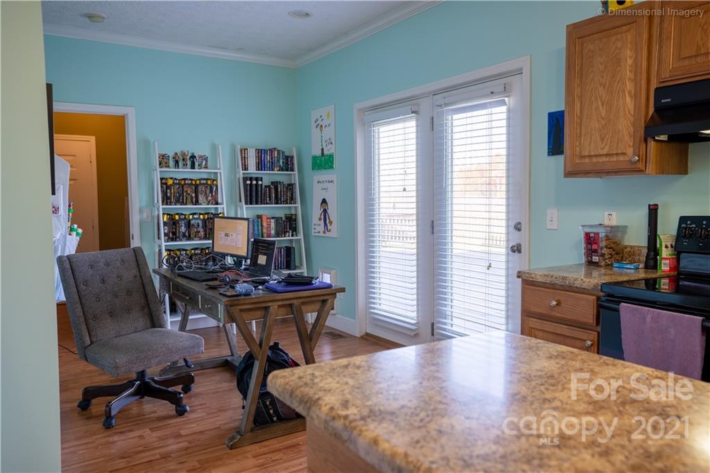 1117 North Ridge Road Hendersonville, NC 28792 - Photo 15 of 35 a view of a workspace with furniture and a window