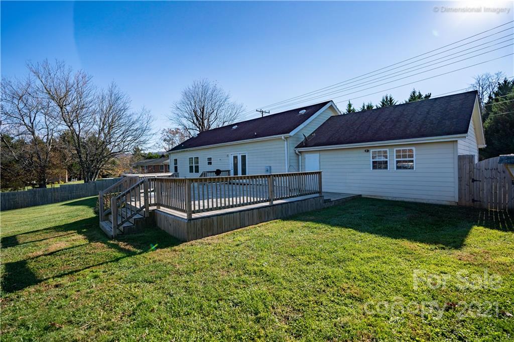 1117 North Ridge Road Hendersonville, NC 28792 - Photo 26 of 35 a view of a house with backyard and garden